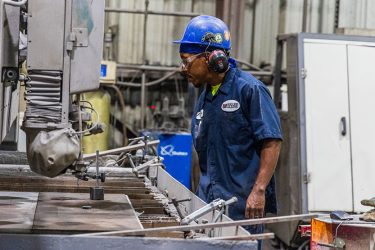 New team member receiving paid machine operator training at Rolled Alloys. Start a manufacturing career in Toledo or Cincinnati, Ohio.