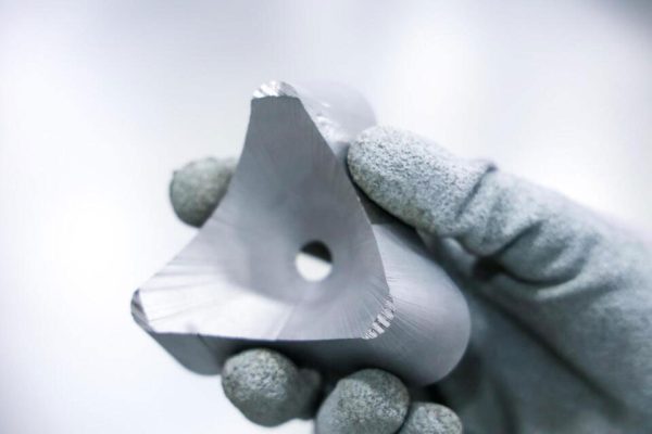 5-axis waterjet bevel cutting examples, including tapered and angled edges, precision holes, and clean cuts on metal parts.