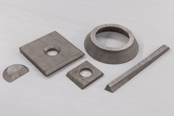 5-axis waterjet bevel cutting examples, including tapered and angled edges, precision holes, and clean cuts on metal parts.